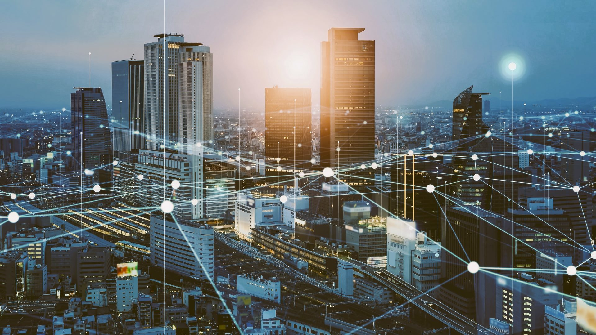 mart city skyline with digital connectivity lines, highlighting VigilantIoE’s IoE solutions for urban innovation, public services, and smart infrastructure.